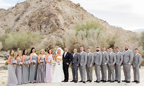 Desert mountains provide wonderful backdrops for wedding party photos.