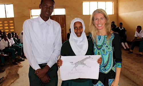 Tanzanian students present a program on giraffe ecology and conservation.