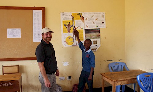 Photo of Mike Chedester with Tanzanian student.