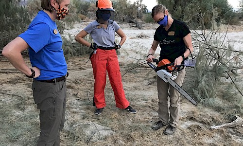 Mary Thomas, Natalie Gonzalez and Emily (Lou) Thomas (left to right).  Training session on the use and safety of chainsaws.