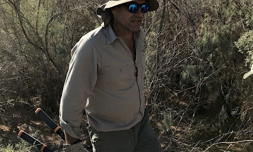 Dr. James Danoff-Burg with loppers for cutting tamarisk